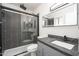 Modern bathroom featuring a glass enclosed shower, sleek vanity, and stylish finishes at 562 W Keats Ave, Mesa, AZ 85210