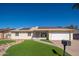 Charming single-story home with solar panels, well-maintained landscaping, and a two-car garage at 562 W Keats Ave, Mesa, AZ 85210