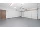 Spacious two-car garage featuring an automatic door and ample room for parking and storage at 562 W Keats Ave, Mesa, AZ 85210