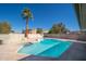 A large swimming pool with diving board, basketball hoop and hot tub create the backyard oasis with space to entertain at 562 W Keats Ave, Mesa, AZ 85210