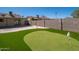 The artificial turf putting green in the backyard is great for practicing your short game at 562 W Keats Ave, Mesa, AZ 85210