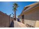 Paver walkway along block wall to house exterior with security door and sunny sky at 562 W Keats Ave, Mesa, AZ 85210