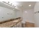 Bathroom featuring single sink vanity with granite countertops and tub/shower combo at 6223 N 12Th St # 8, Phoenix, AZ 85014