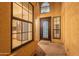Inviting home entrance featuring a decorative front door, large windows, and view of the stainless steel kitchen appliances at 6223 N 12Th St # 8, Phoenix, AZ 85014