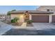 Inviting condo features a well-maintained exterior with a private garage and desert landscaping at 6223 N 12Th St # 8, Phoenix, AZ 85014