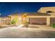 Charming home exterior with a two-car garage, well-manicured landscaping, and inviting curb appeal at 6223 N 12Th St # 8, Phoenix, AZ 85014