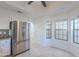 Bright kitchen featuring stainless steel refrigerator, tile flooring, and granite countertops at 6223 N 12Th St # 8, Phoenix, AZ 85014
