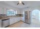 Modern kitchen with stainless steel appliances, granite countertops, and white cabinetry at 6223 N 12Th St # 8, Phoenix, AZ 85014
