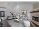 Elegant living room with vaulted ceilings, fireplace, and stylish furniture at 6223 N 12Th St # 8, Phoenix, AZ 85014