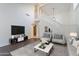 Bright living room with high ceilings, elegant decor, and a staircase at 6223 N 12Th St # 8, Phoenix, AZ 85014
