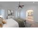 Spacious main bedroom with ensuite bathroom, ceiling fan, and french doors at 6223 N 12Th St # 8, Phoenix, AZ 85014