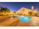 Stunning backyard pool and hot tub area, beautifully lit for evening relaxation and entertainment at 6223 N 12Th St # 8, Phoenix, AZ 85014