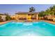 Sparkling community pool with a covered seating area offering a tranquil escape in a lush environment at 6223 N 12Th St # 8, Phoenix, AZ 85014
