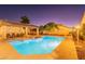 Beautiful community pool with a covered seating area offering a tranquil escape in a lush environment at 6223 N 12Th St # 8, Phoenix, AZ 85014
