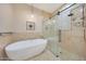 Bathroom featuring a soaking tub and a walk-in shower at 6615 E Shea Blvd, Scottsdale, AZ 85254