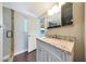 Bathroom featuring granite countertops, a glass shower, and access to the backyard at 6615 E Shea Blvd, Scottsdale, AZ 85254