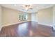 Spacious bedroom with wood-look flooring, a large window, and neutral colors at 6615 E Shea Blvd, Scottsdale, AZ 85254