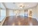 Spacious bedroom with wood-look flooring, large windows, and a modern barn door at 6615 E Shea Blvd, Scottsdale, AZ 85254