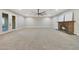 Spacious bonus room with fireplace, large windows and backyard access at 6615 E Shea Blvd, Scottsdale, AZ 85254