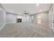 The bonus room is large with a fireplace, a ceiling fan, and three separate access doors at 6615 E Shea Blvd, Scottsdale, AZ 85254