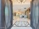 Elegant entryway showcasing an ornate tile design, open floor plan, and custom built-ins at 6615 E Shea Blvd, Scottsdale, AZ 85254