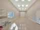 Clean garage with epoxy flooring, bright lighting, and storage racks, providing a functional and organized space at 6615 E Shea Blvd, Scottsdale, AZ 85254