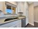 Well-lit kitchen featuring stainless steel appliances and updated cabinets at 6615 E Shea Blvd, Scottsdale, AZ 85254