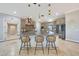 Spacious kitchen with large island, seating, granite countertops and stainless steel appliances at 6615 E Shea Blvd, Scottsdale, AZ 85254