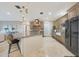 Open kitchen featuring a large island, stainless steel appliances, and ample cabinet space at 6615 E Shea Blvd, Scottsdale, AZ 85254