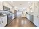 Open kitchen featuring stainless steel appliances and white cabinetry at 6615 E Shea Blvd, Scottsdale, AZ 85254
