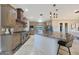 Modern kitchen with an island, stainless steel appliances, and granite countertops at 6615 E Shea Blvd, Scottsdale, AZ 85254