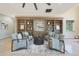 Inviting living room featuring custom built-in bookshelves and comfortable seating arrangements at 6615 E Shea Blvd, Scottsdale, AZ 85254