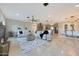 Spacious living room featuring fireplace, tile floor, and views to the kitchen and dining areas at 6615 E Shea Blvd, Scottsdale, AZ 85254