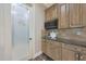 Charming pantry with custom cabinets and frosted glass door for optimal kitchen storage solutions at 6615 E Shea Blvd, Scottsdale, AZ 85254