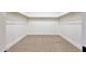 Spacious walk-in closet with ample shelving and carpeting at 6615 E Shea Blvd, Scottsdale, AZ 85254