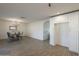 Open-concept dining room with a modern chandelier and updated flooring at 6808 W Sierra St, Peoria, AZ 85345