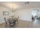 Bright dining room boasting stylish chandelier, round table and neutral finishes at 6808 W Sierra St, Peoria, AZ 85345