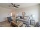 Bright living room with comfortable seating and stylish decor, bathed in natural light at 6808 W Sierra St, Peoria, AZ 85345