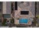 Aerial view of a luxurious home with a pool, spa, outdoor kitchen, and manicured landscaping at 7157 E Ivyglen Cir, Mesa, AZ 85207