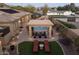 Backyard featuring an outdoor kitchen area, pool, and lounge seating for outdoor living at 7157 E Ivyglen Cir, Mesa, AZ 85207