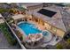 Aerial view of a private backyard with a pool, hot tub, slide and outdoor seating at 7157 E Ivyglen Cir, Mesa, AZ 85207