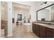 Luxurious bathroom showcasing a soaking tub, walk-in shower, and dual vanities at 7157 E Ivyglen Cir, Mesa, AZ 85207