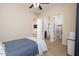Bright bedroom with en-suite bathroom and walk-in closet at 7157 E Ivyglen Cir, Mesa, AZ 85207