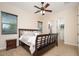 Inviting bedroom featuring windows, and a ceiling fan at 7157 E Ivyglen Cir, Mesa, AZ 85207