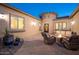 Charming courtyard with a fire pit, comfortable seating, and elegant design at 7157 E Ivyglen Cir, Mesa, AZ 85207