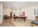 Spacious game room featuring a pool table, comfortable seating, and neutral décor at 7157 E Ivyglen Cir, Mesa, AZ 85207