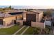 Exterior shot of garages with artificial turf and gated access at 7157 E Ivyglen Cir, Mesa, AZ 85207