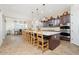 Expansive kitchen features an island with seating and modern stainless steel appliances at 7157 E Ivyglen Cir, Mesa, AZ 85207