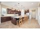 Expansive kitchen features an island with seating and modern stainless steel appliances at 7157 E Ivyglen Cir, Mesa, AZ 85207