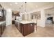 Expansive kitchen features an island with seating and modern stainless steel appliances at 7157 E Ivyglen Cir, Mesa, AZ 85207